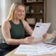 Stella Brown owner-operator reviewing commercial auto insurance quotes at home office desk in Columbus Ohio